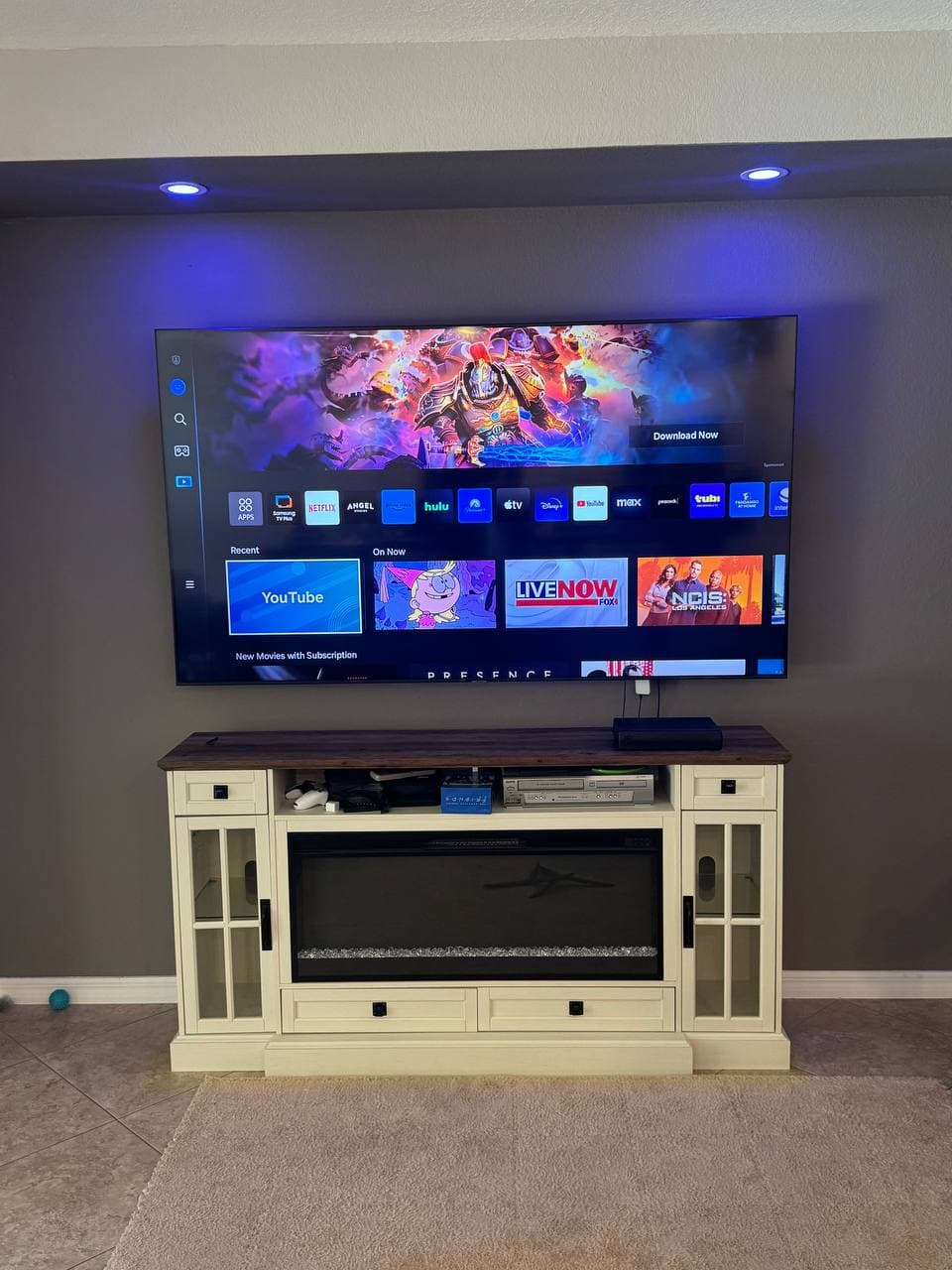 TV Mounted Above an Electric Fireplace Console in Davie, FL