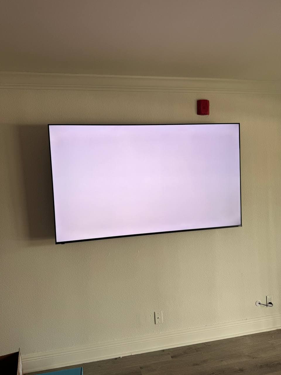 TV Mount Near a Fire Alarm Strobe in a Tamarac, FL Condo