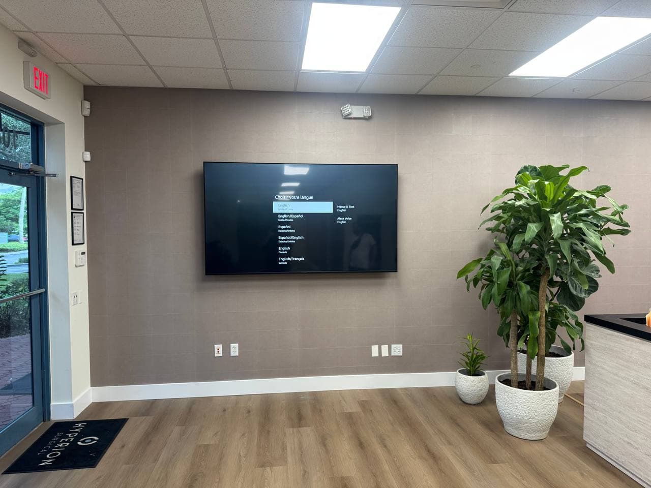 86-Inch TV Mounted on a Tiled Wall in a Weston, FL Commercial Office